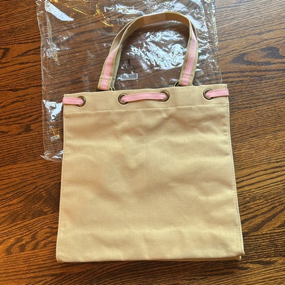 YSL tan canvas pink embroidered woven grosgrain/canvas drawstring closure tote. - Picture 3 of 6